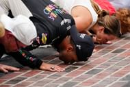 Cup Series driver Bubba Wallace (23) kisses the bricks Sunday, July 27, 2025, during the Brickyard 400 - Source: Imagn